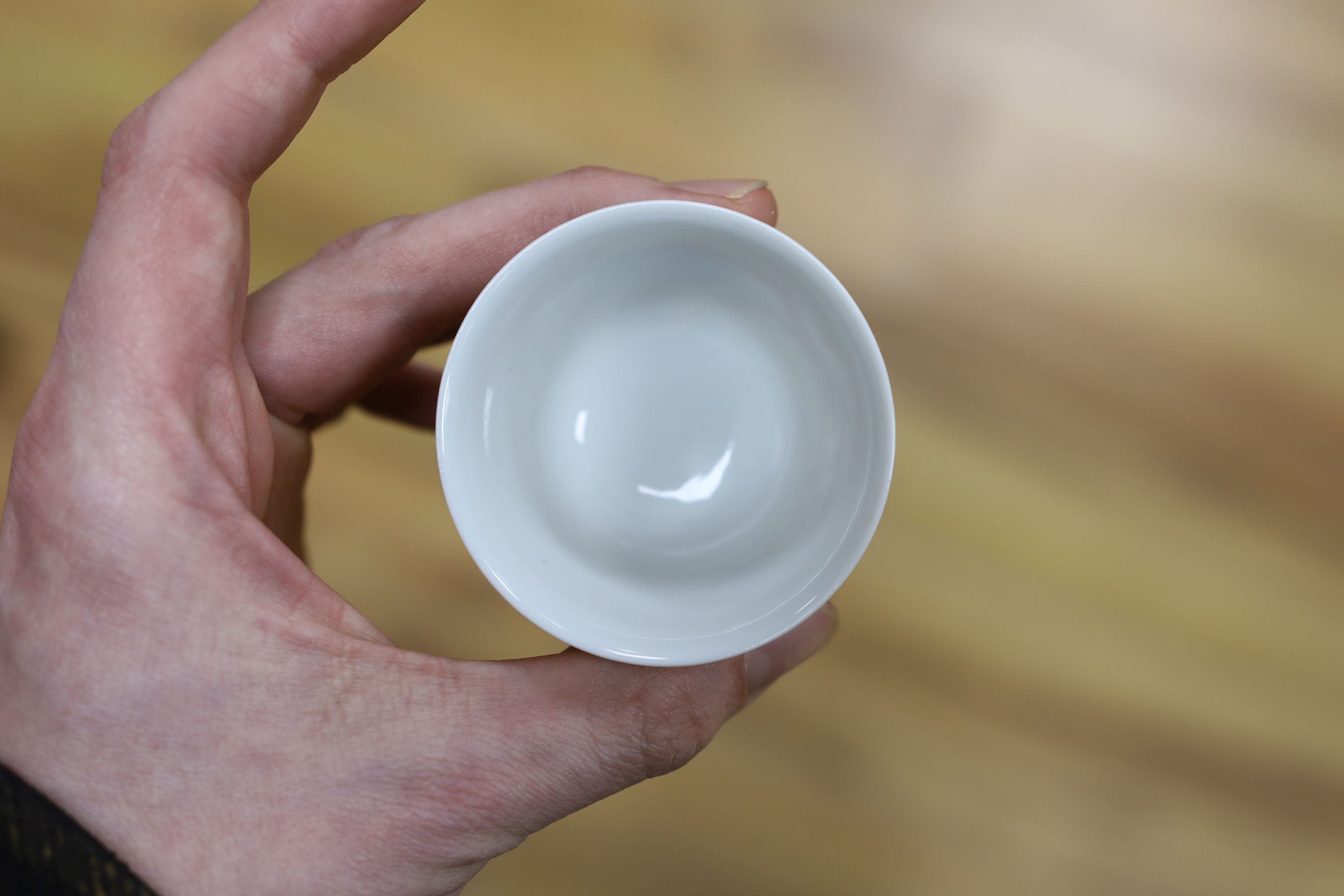 A Chinese iron red enamelled ‘dragon’ tea bowl, 5cm high